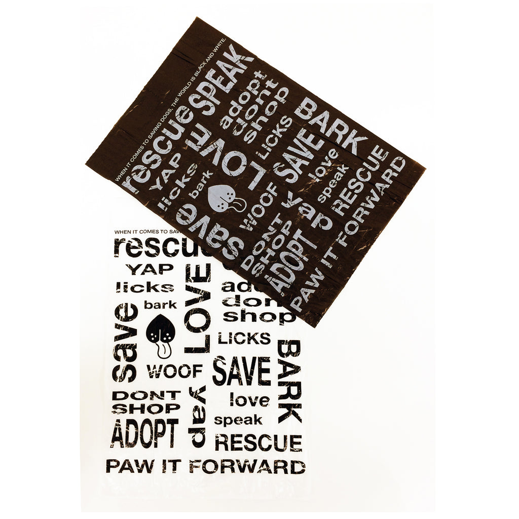 Flat lay of Love & Licks GOOD KARMA Poop Bags showing design of black and white bags with rescue phrases.