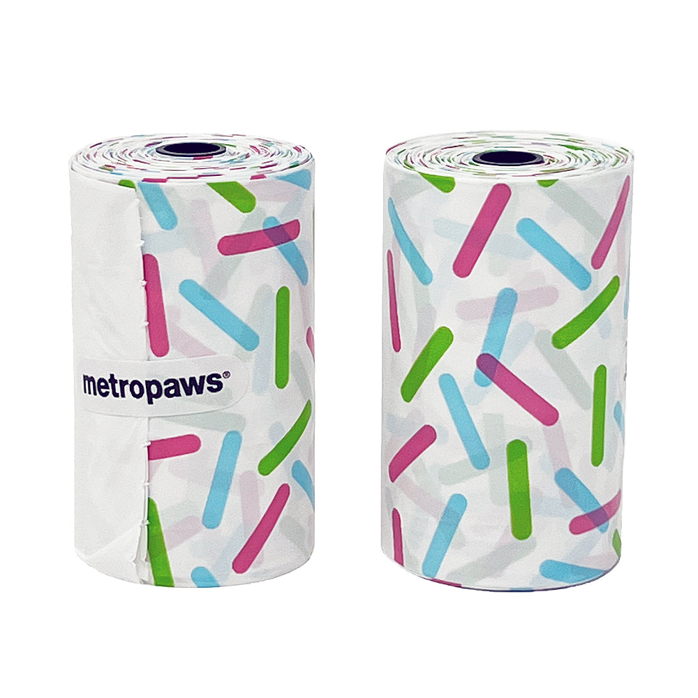 Two rolls of Sprinkles Poopy Packs degradable poop bags feauring tri-color sprinkles design
